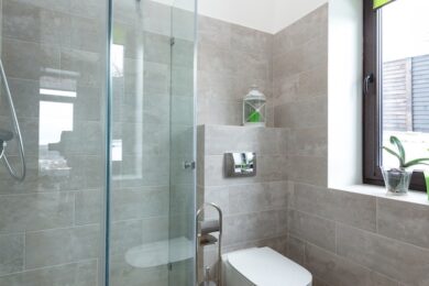see through glass shower door and toilet